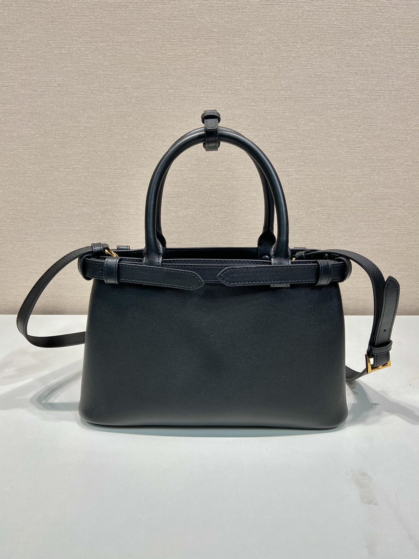 Pra*a buckle small leather handbag with double belt