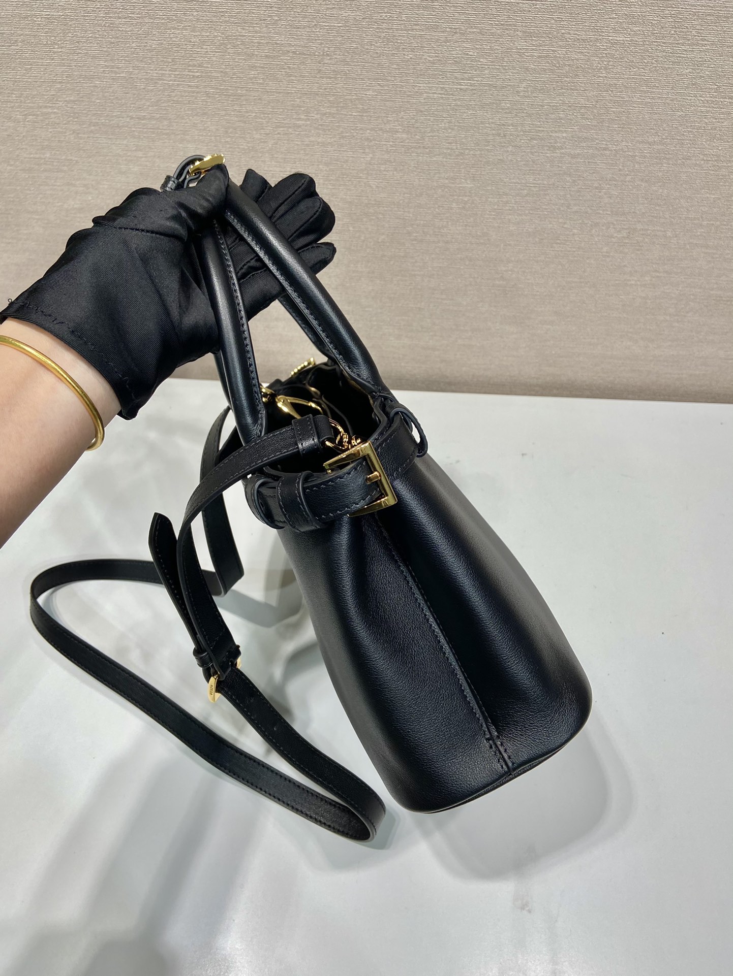 Pra*a buckle small leather handbag with double belt
