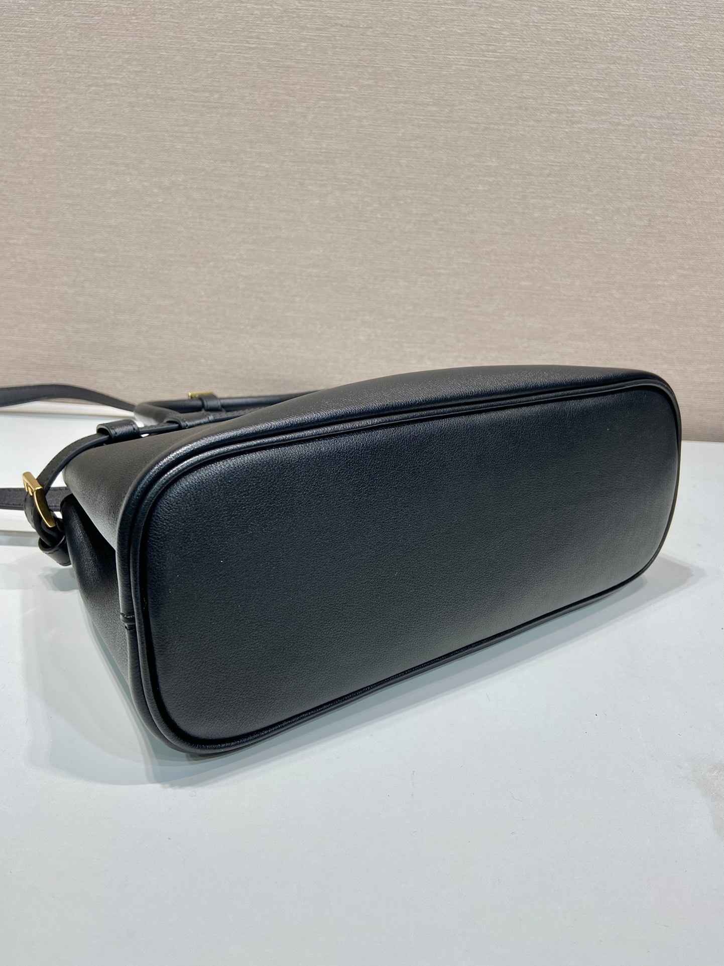 Pra*a buckle small leather handbag with double belt