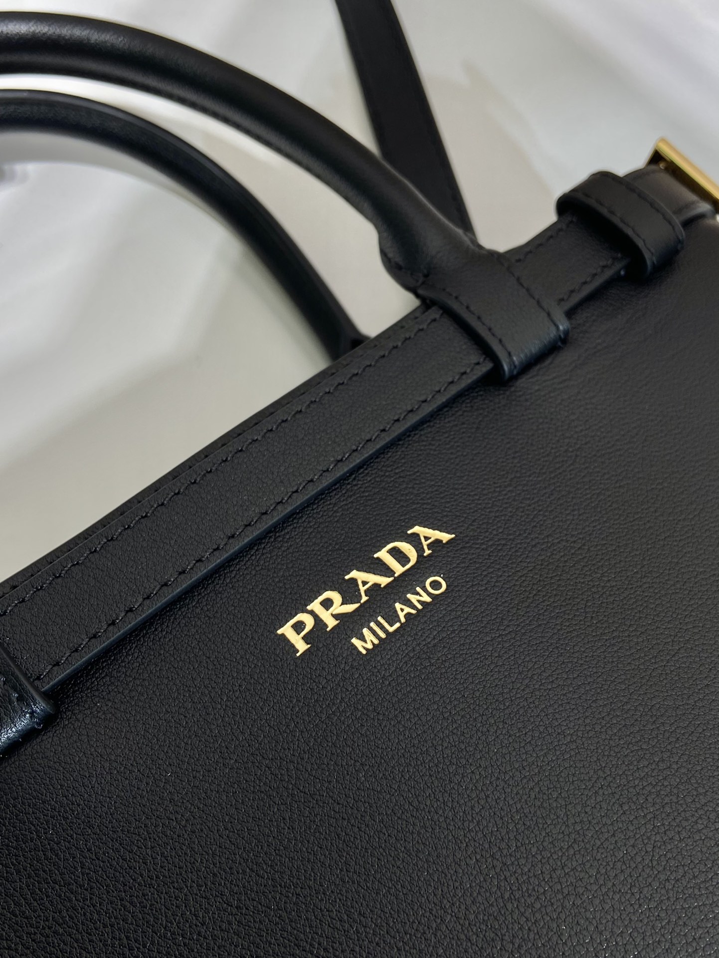 Pra*a buckle small leather handbag with double belt