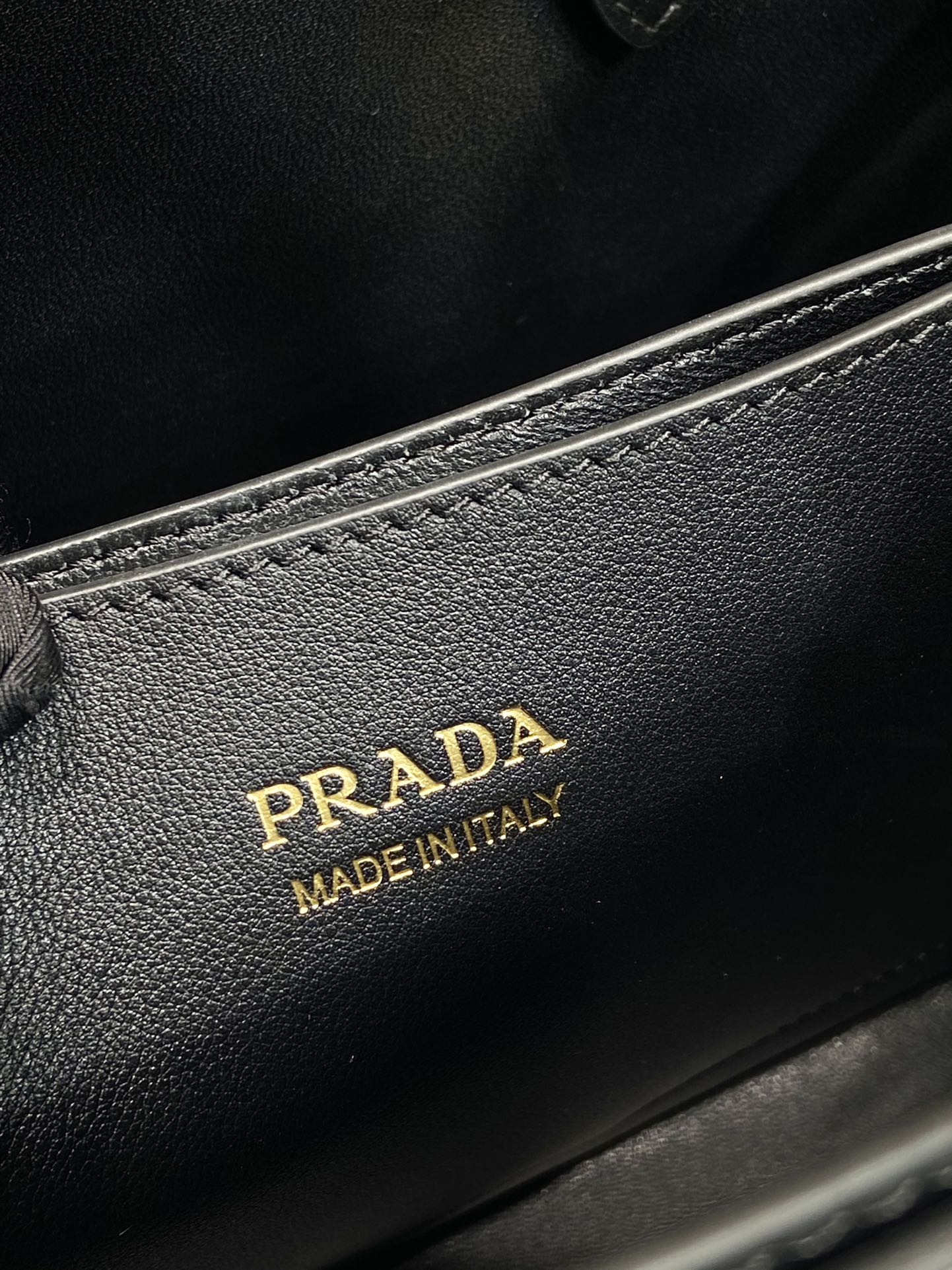 Pra*a buckle small leather handbag with double belt