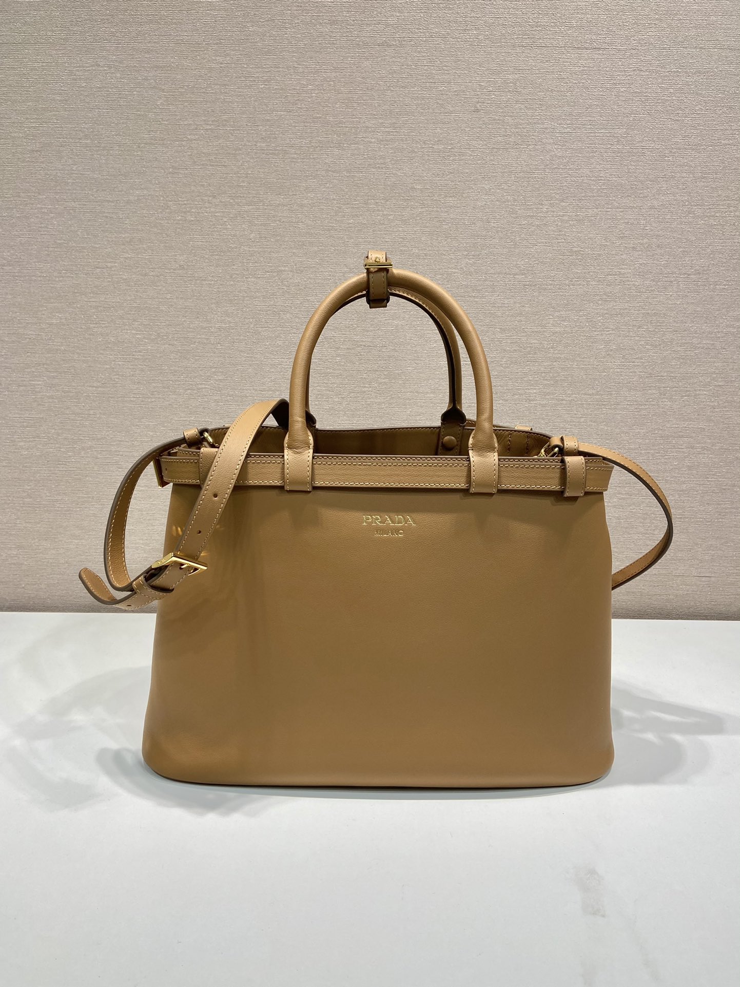 Pra*a buckle medium leather handbag with double belt