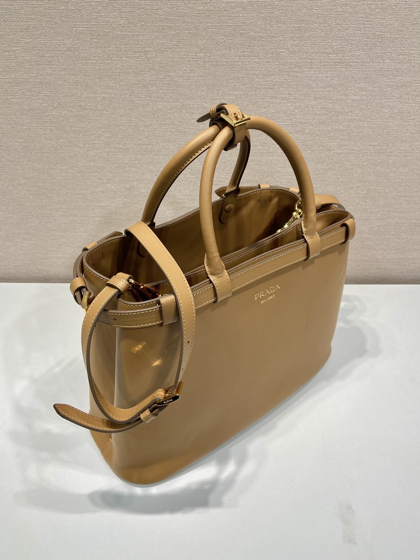 Pra*a buckle medium leather handbag with double belt