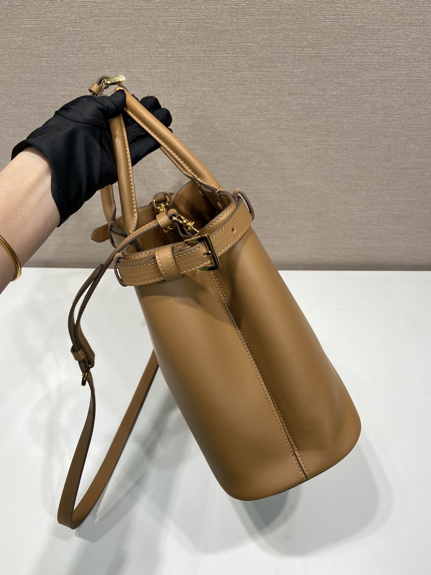 Pra*a buckle medium leather handbag with double belt