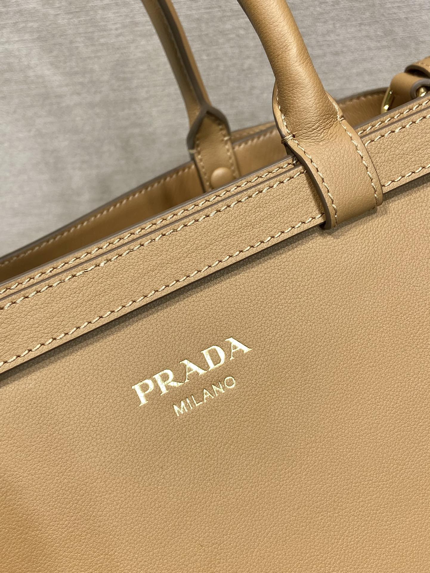 Pra*a buckle medium leather handbag with double belt