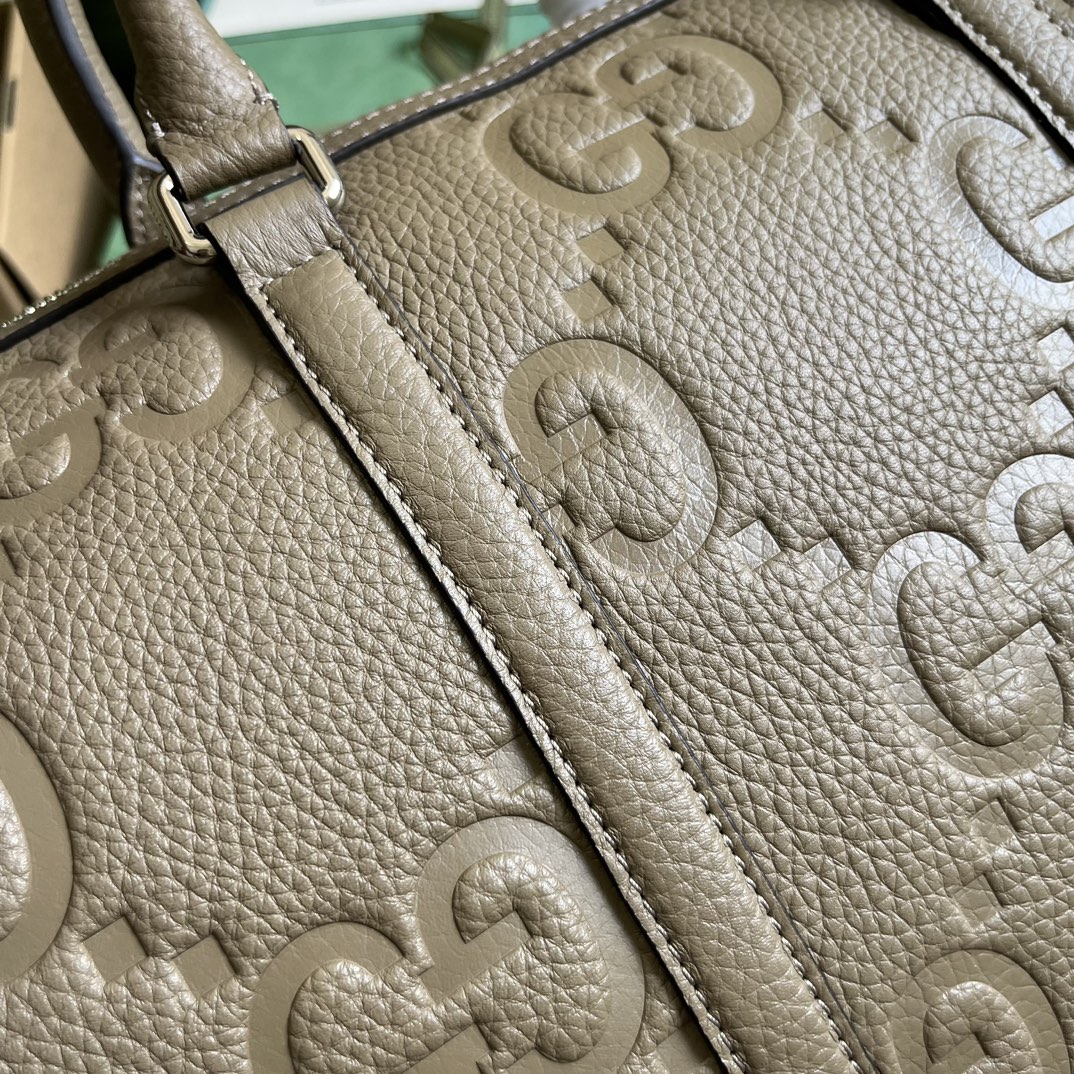 G*u*i gg duffle bag