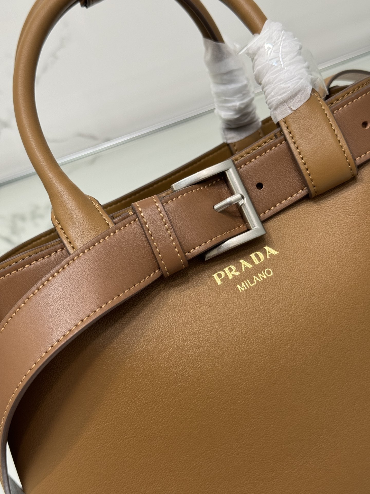 Pra*a buckle medium leather handbag with belt