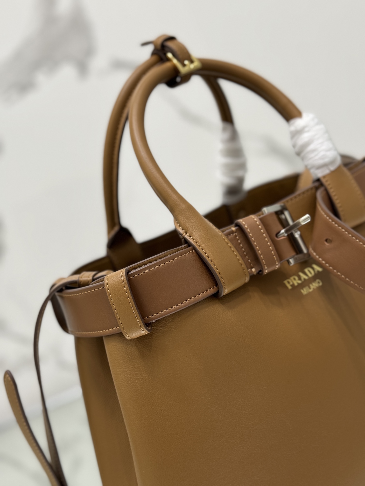 Pra*a buckle medium leather handbag with belt