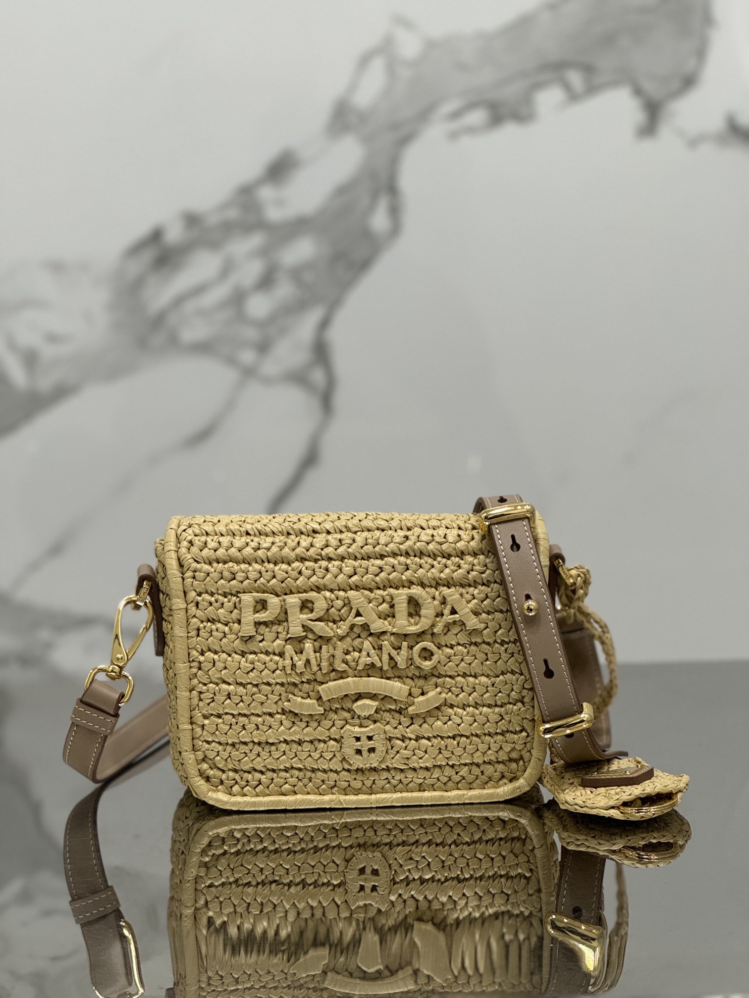 Pra*a crochet and leather shoulder bag with flap