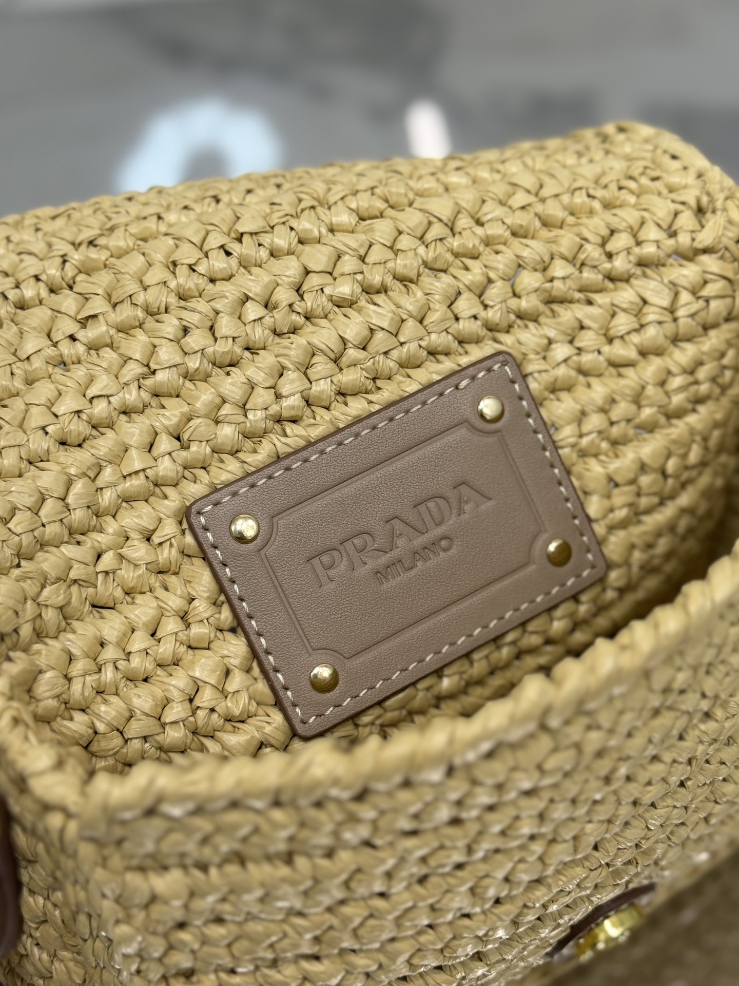 Pra*a crochet and leather shoulder bag with flap