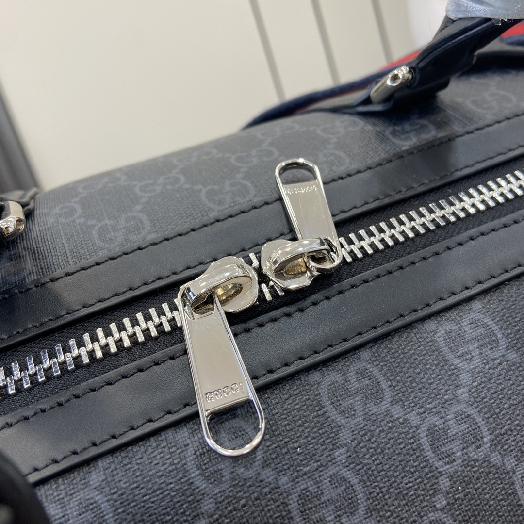 G*u*i gg duffle bag