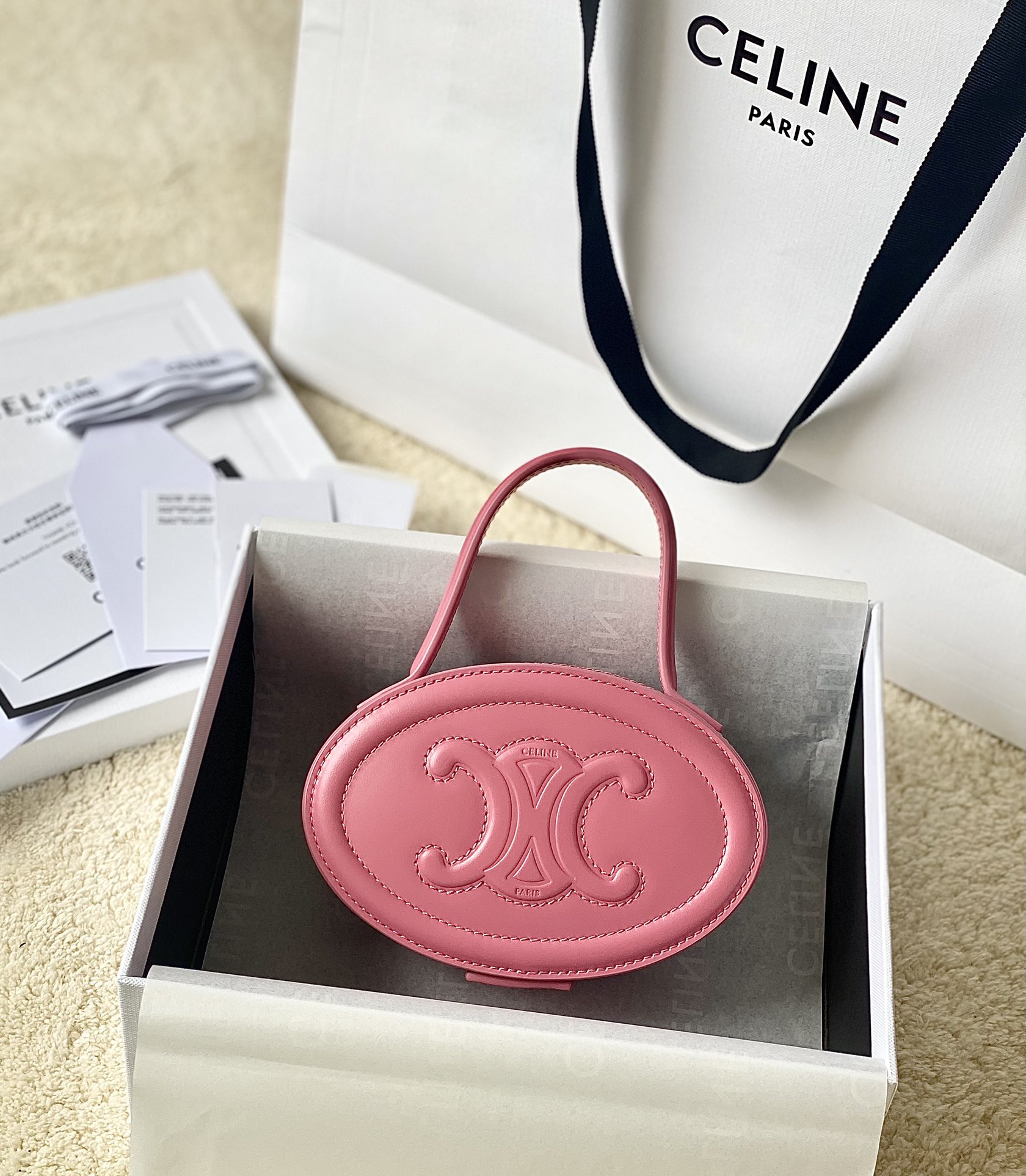 Ce**e oval minaudiere cuir triomphe
