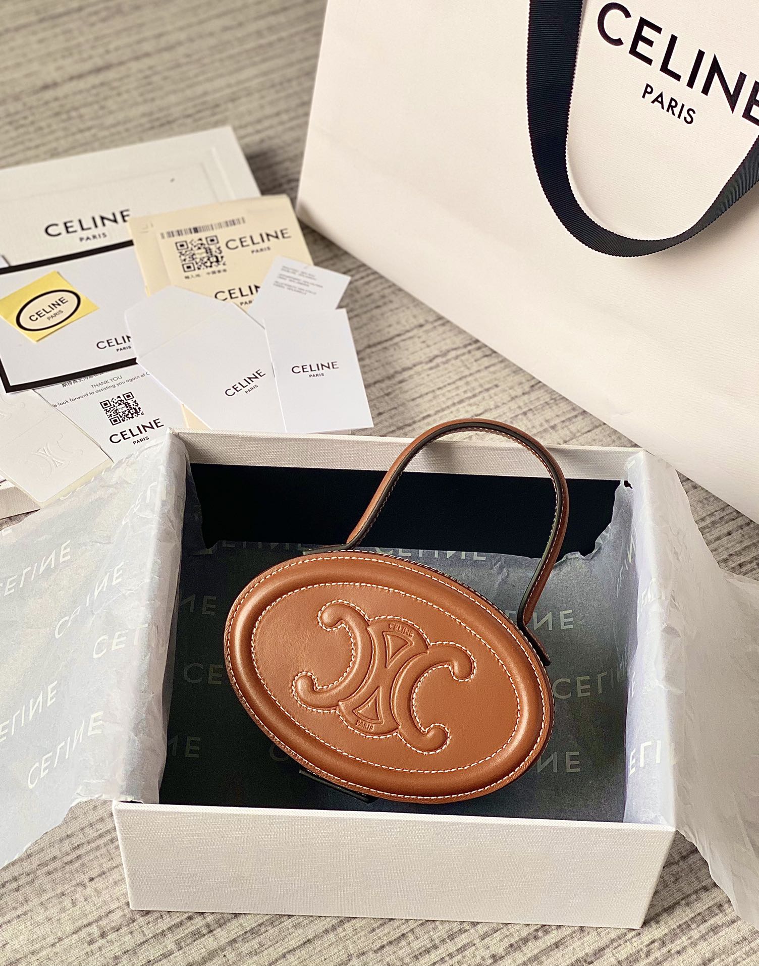 Ce**e oval minaudiere cuir triomphe