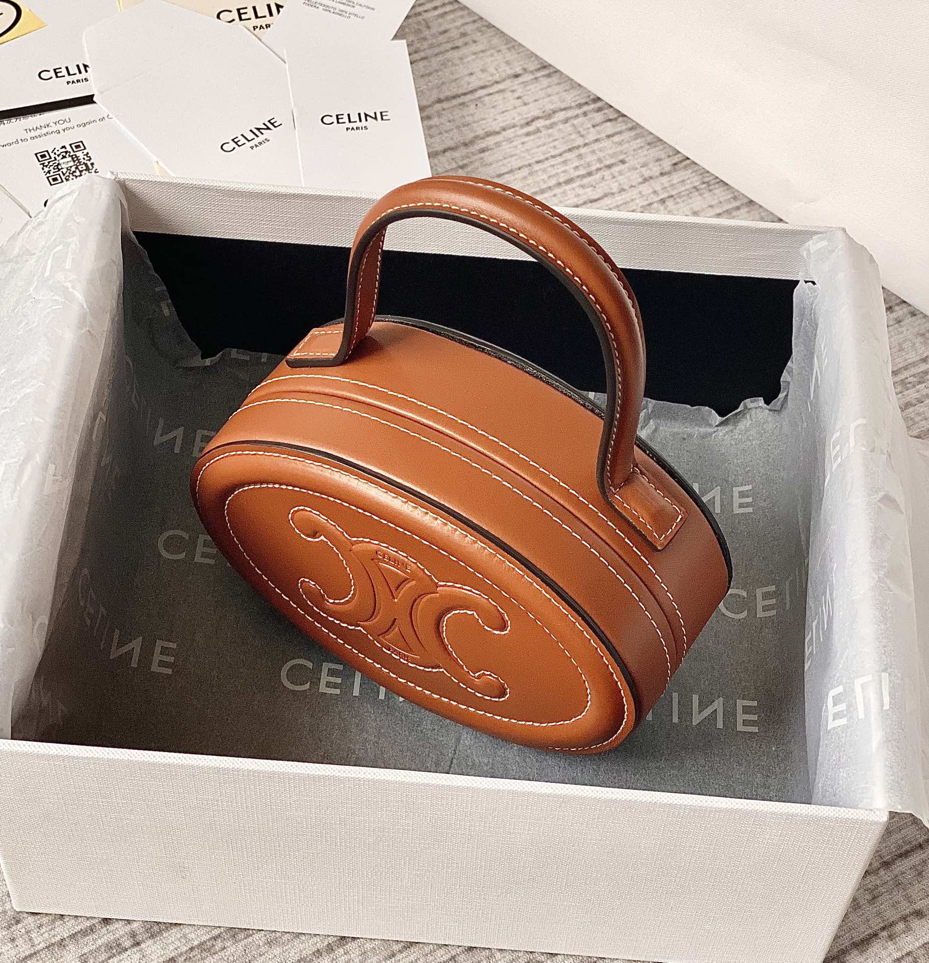 Ce**e oval minaudiere cuir triomphe