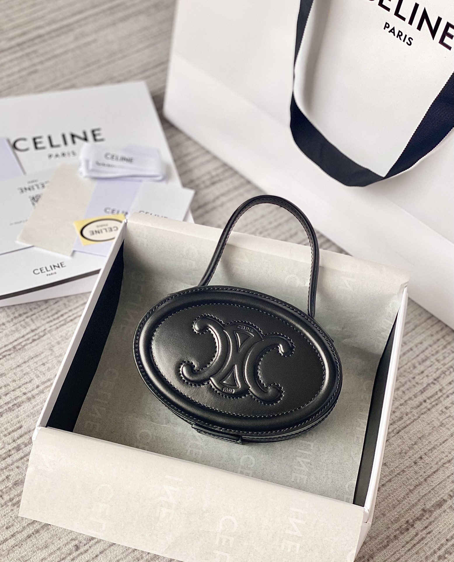 Ce**e oval minaudiere cuir triomphe